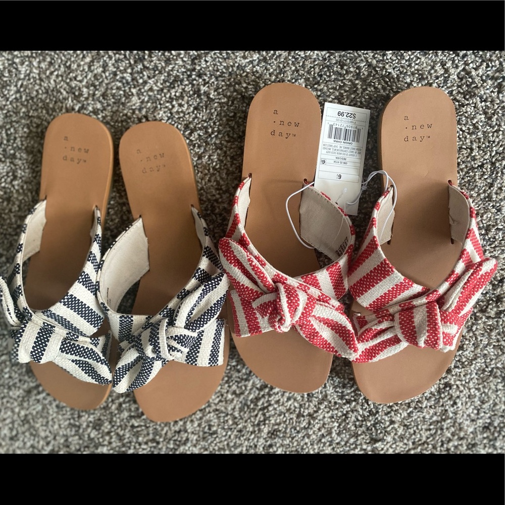 Two pairs of shoes, one red and one blue. Both new and one still has tags